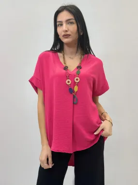 Maglia mezze maniche con collana scollo V